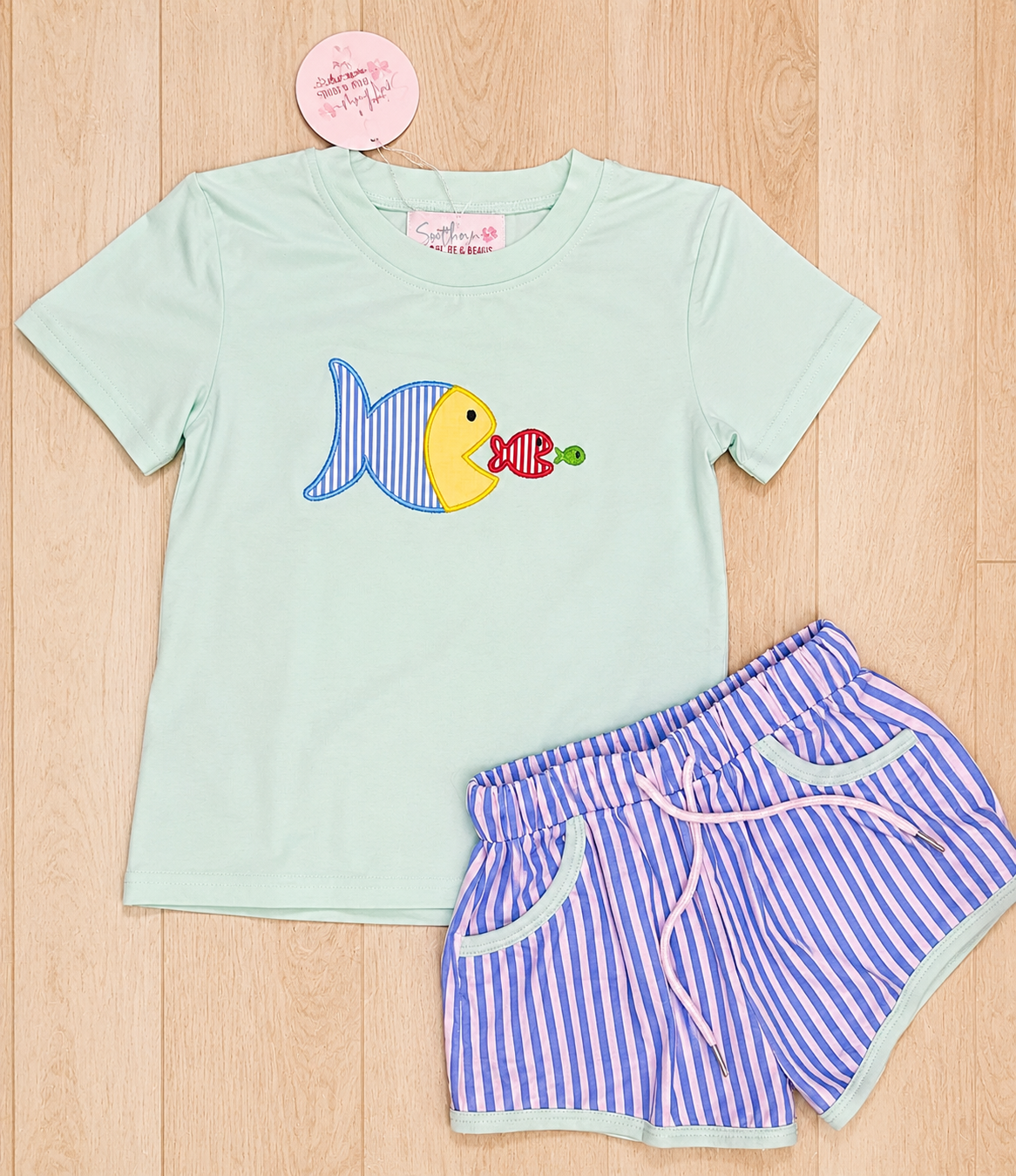 Toddler boy outfit flat lay with three fish appliqué.