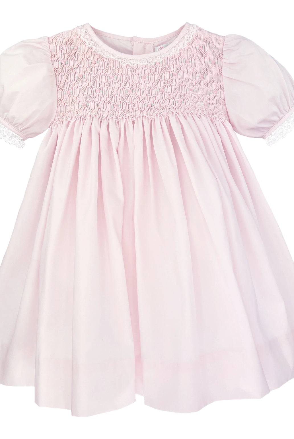 Pink dress with smocked bodice on a white background