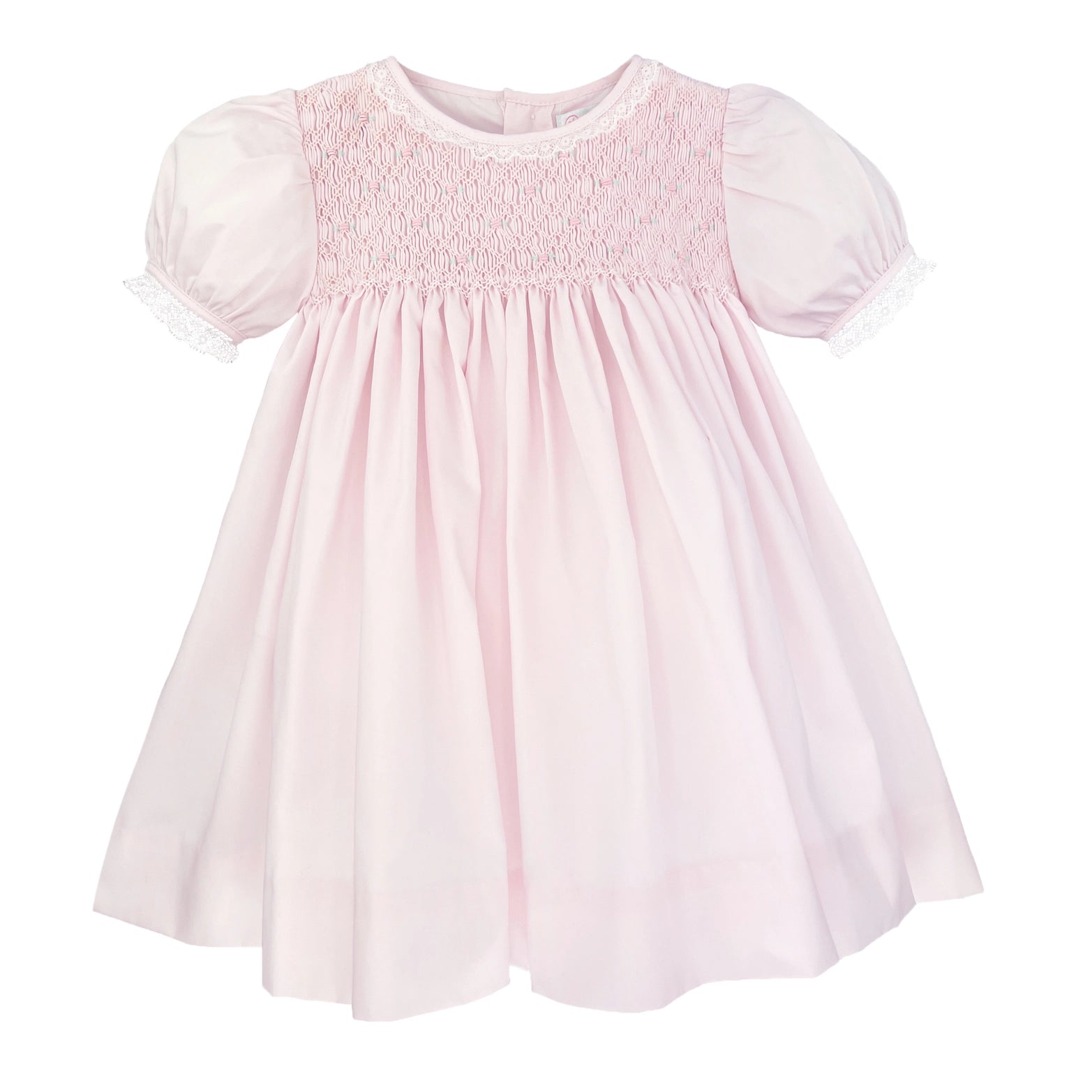 Pink dress with smocked bodice on a white background