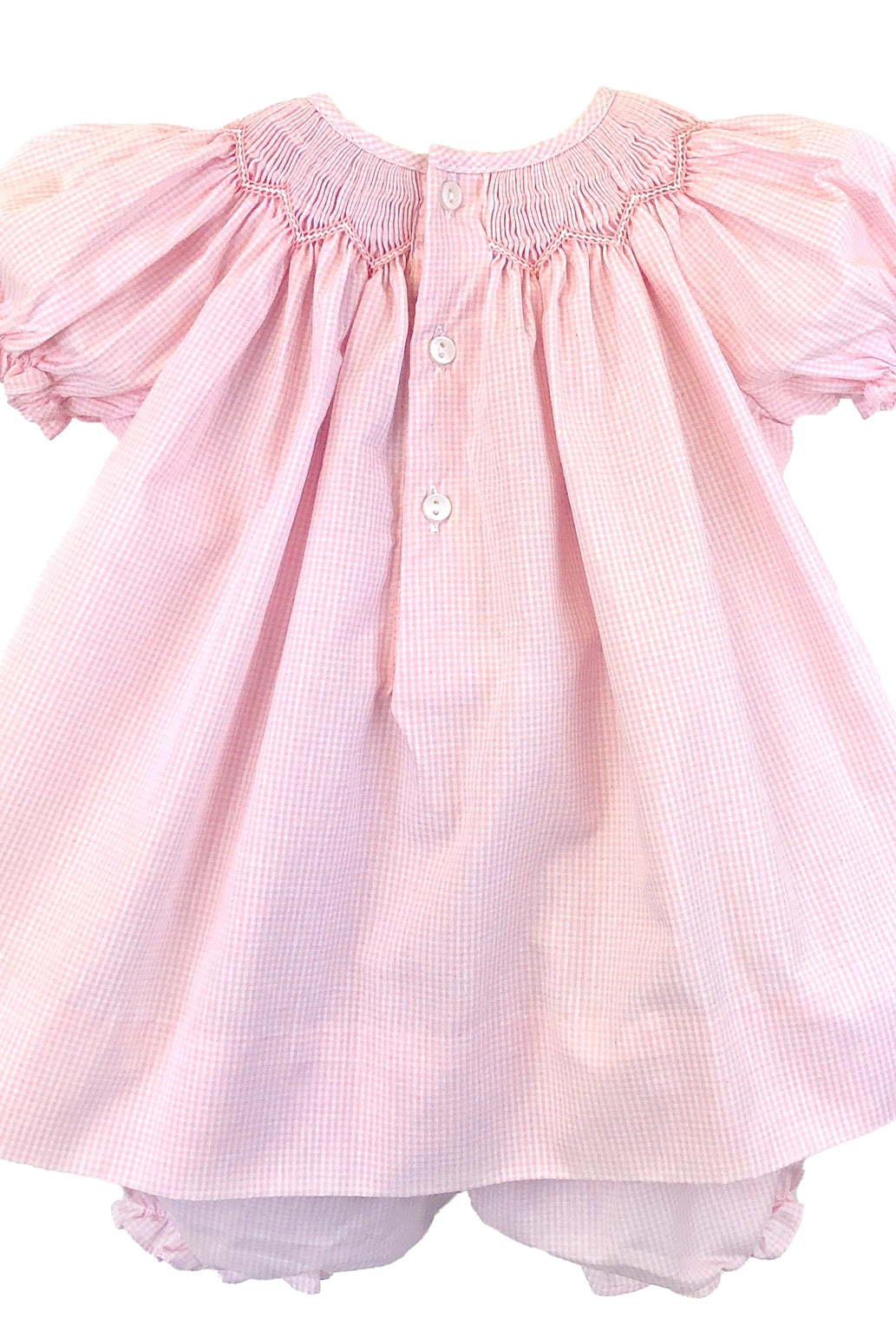 Pink dress with ruffled sleeves on a white background