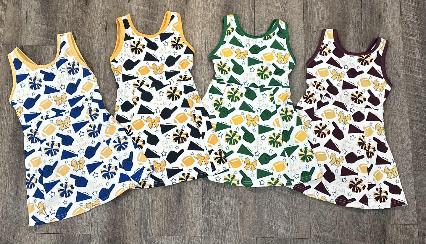 Group image: “Go Team Dresses in navy, black, green, and maroon – Southern Belle & Beaus kids game day collection”
Individual color shots (if uploaded):
“Navy/Gold Go Team Dress for girls”
“Black/Gold Go Team Dress for girls”
“Green/Gold Go Team Dress for girls”
“Maroon/Gold Go Team Dress for girls”