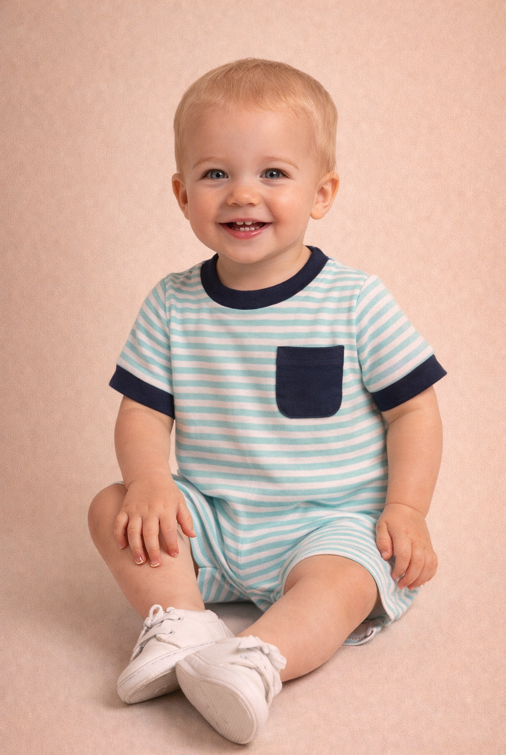 Child wearing a blue and white striped outfit with a pocket on a beige background