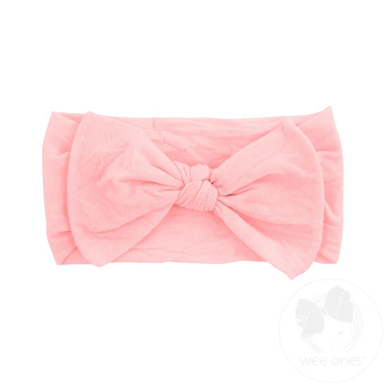 pink nylon baby headband with a bow