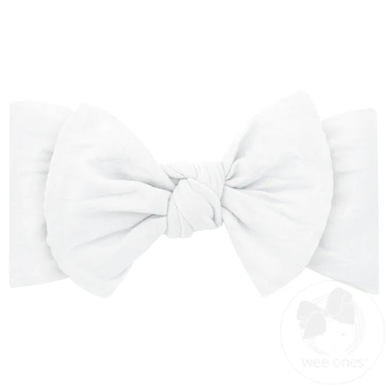A white nylon headband with a bowtie attachment, displayed against a white background.