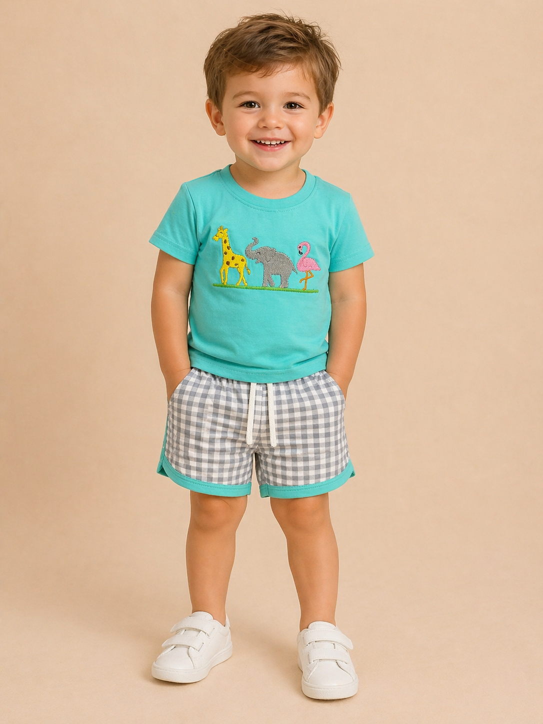 Child wearing a turquoise shirt with animal graphics and checkered shorts on a beige background