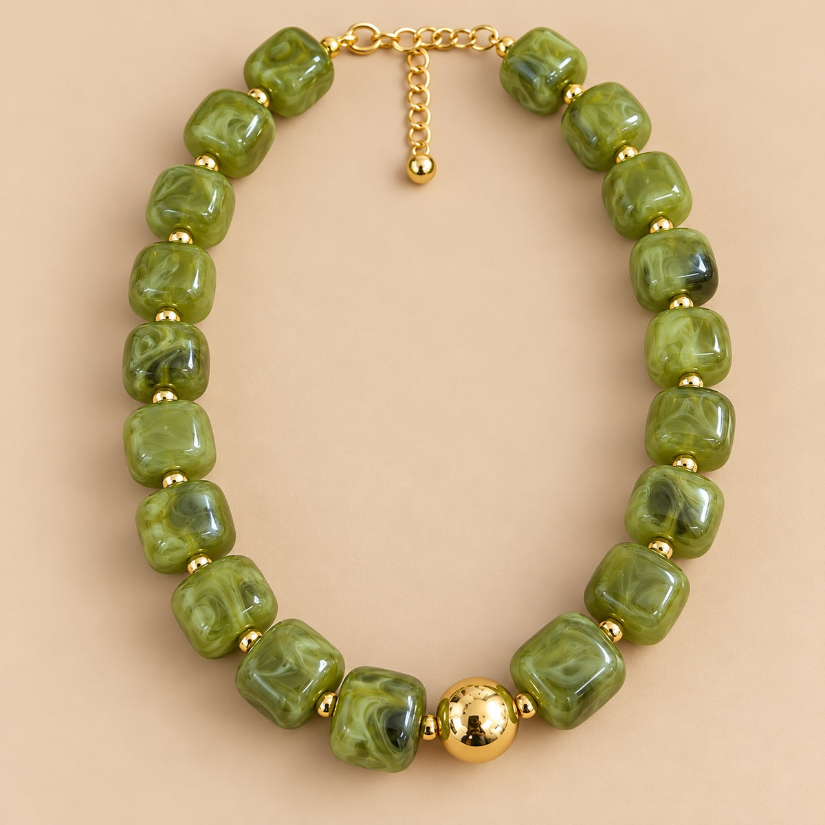 Olive Marble Gold Bead Necklace is a women's jade green beaded statement necklace with gold-tone spacers.