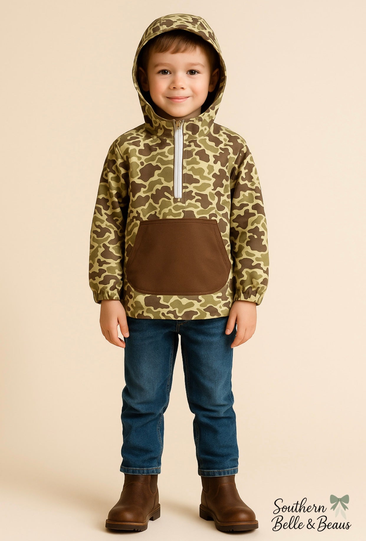 Child wearing a camouflage hoodie with a brown pocket.