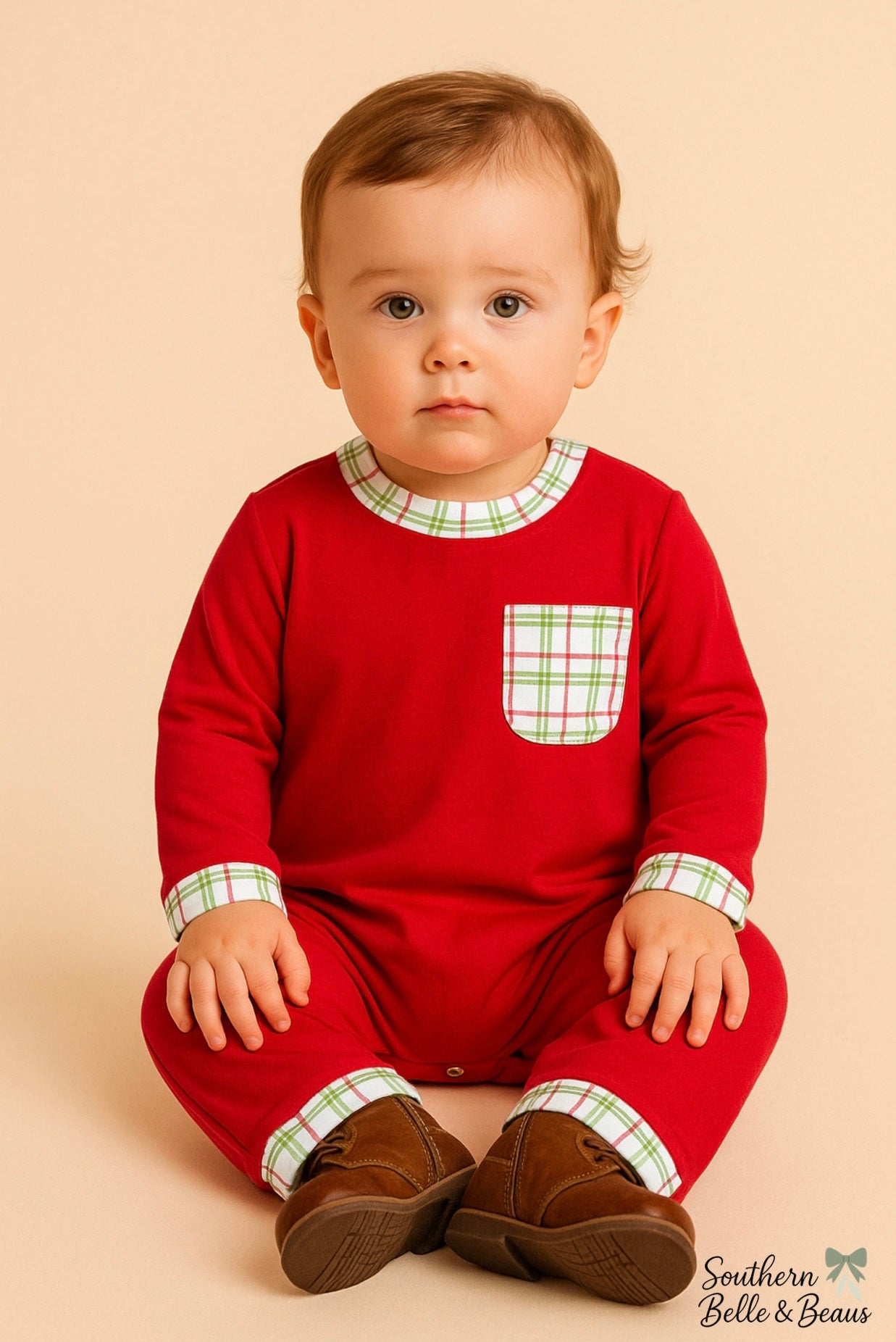 Red boys long sleeve romper with Christmas plaid pocket and plaid trim on sleeve, collar, and cuff