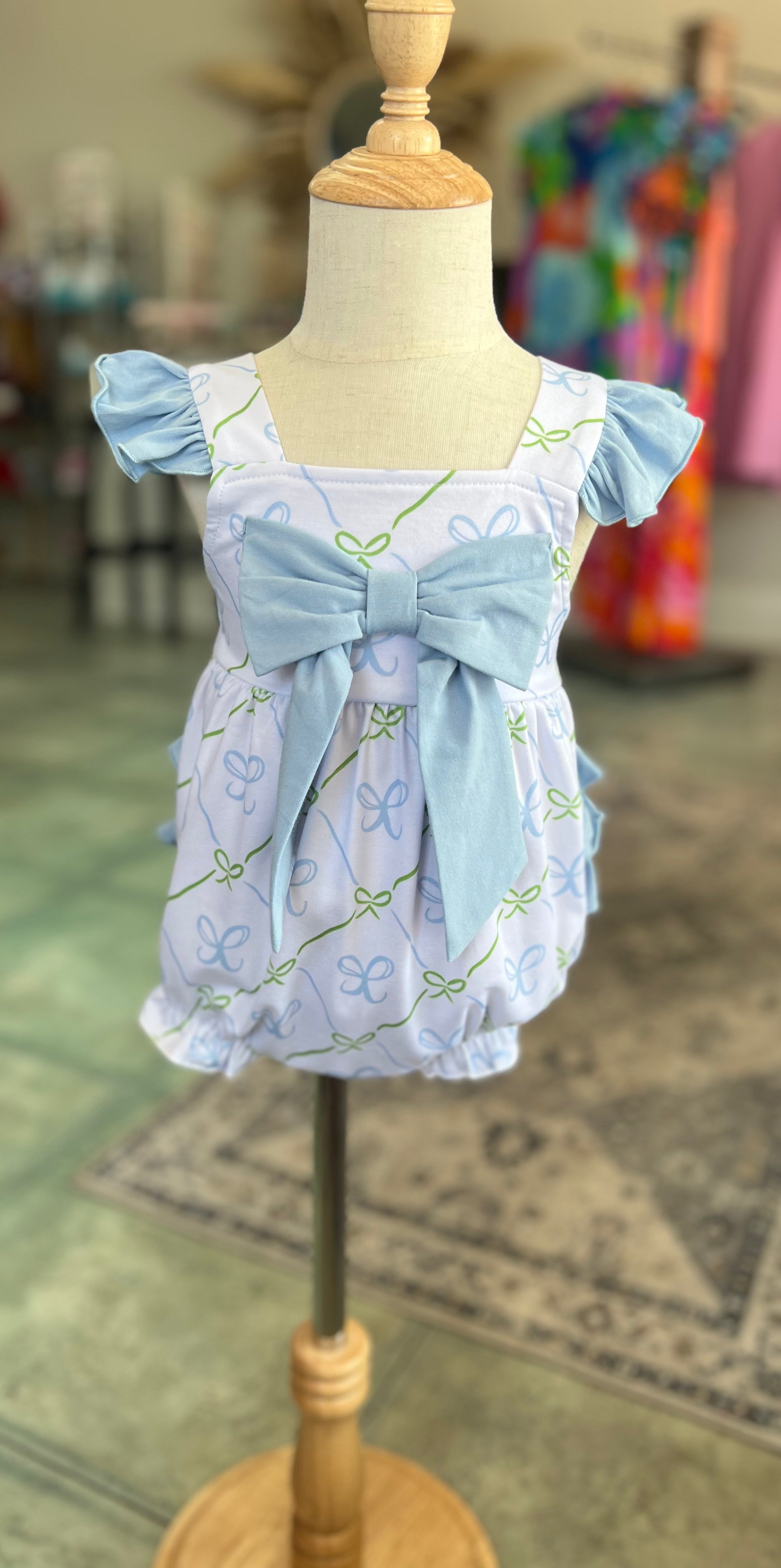 Baby girl sun suit bubble, white light blue bows.