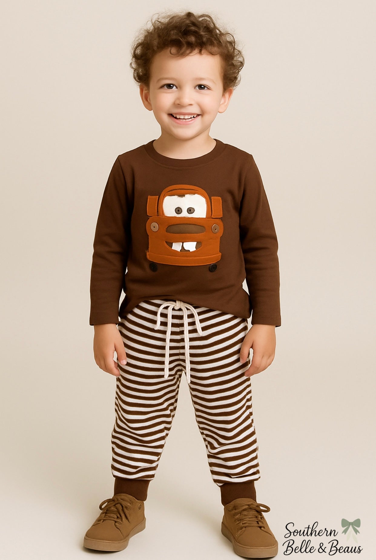Brown long sleeve tow truck top with striped jogger pants.