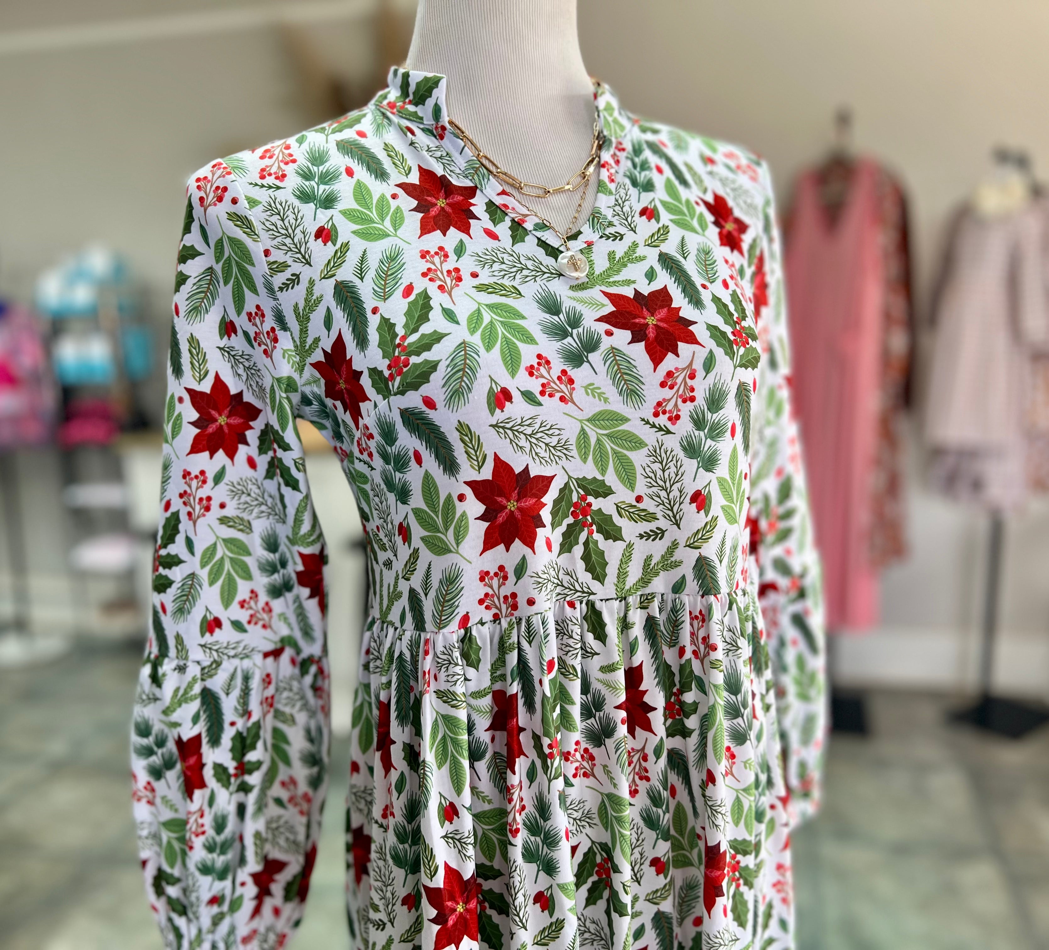 Elegant poinsettia maxi ladies dress with flattering flow.