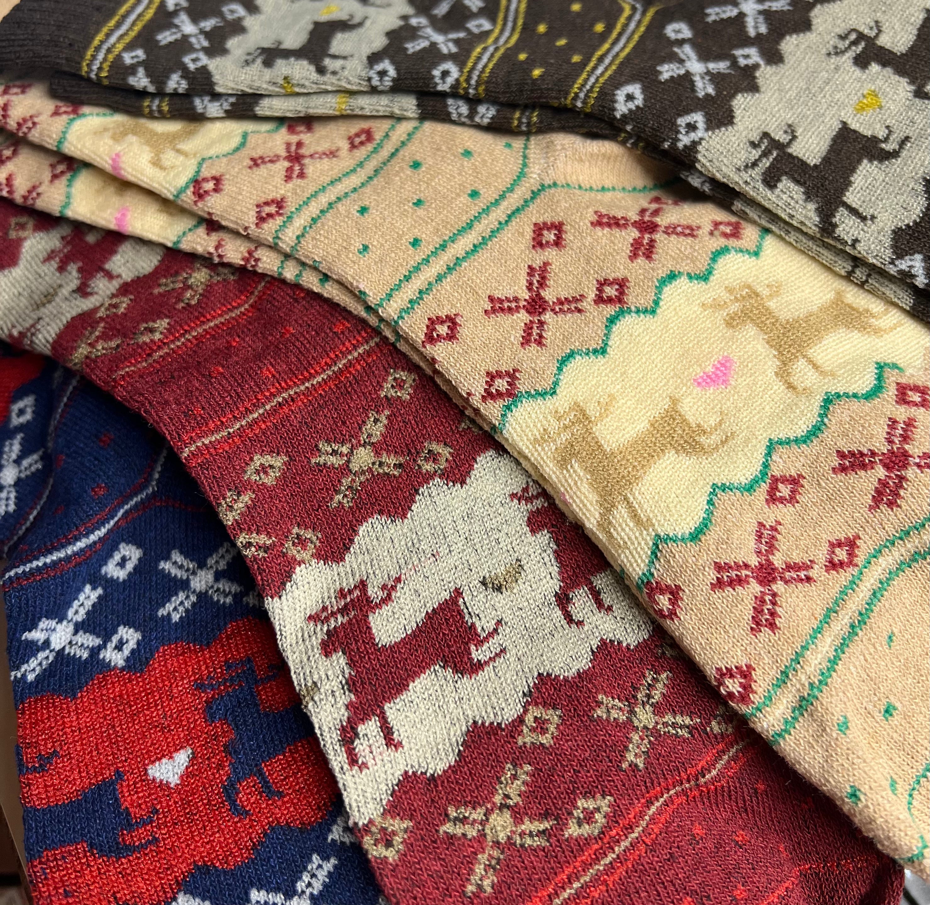 Stack of patterned fabric swatches in various colors and designs.