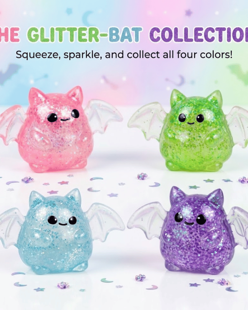 Four glitter bat squishy toys in pink, green, blue, and purple with clear sparkle wings