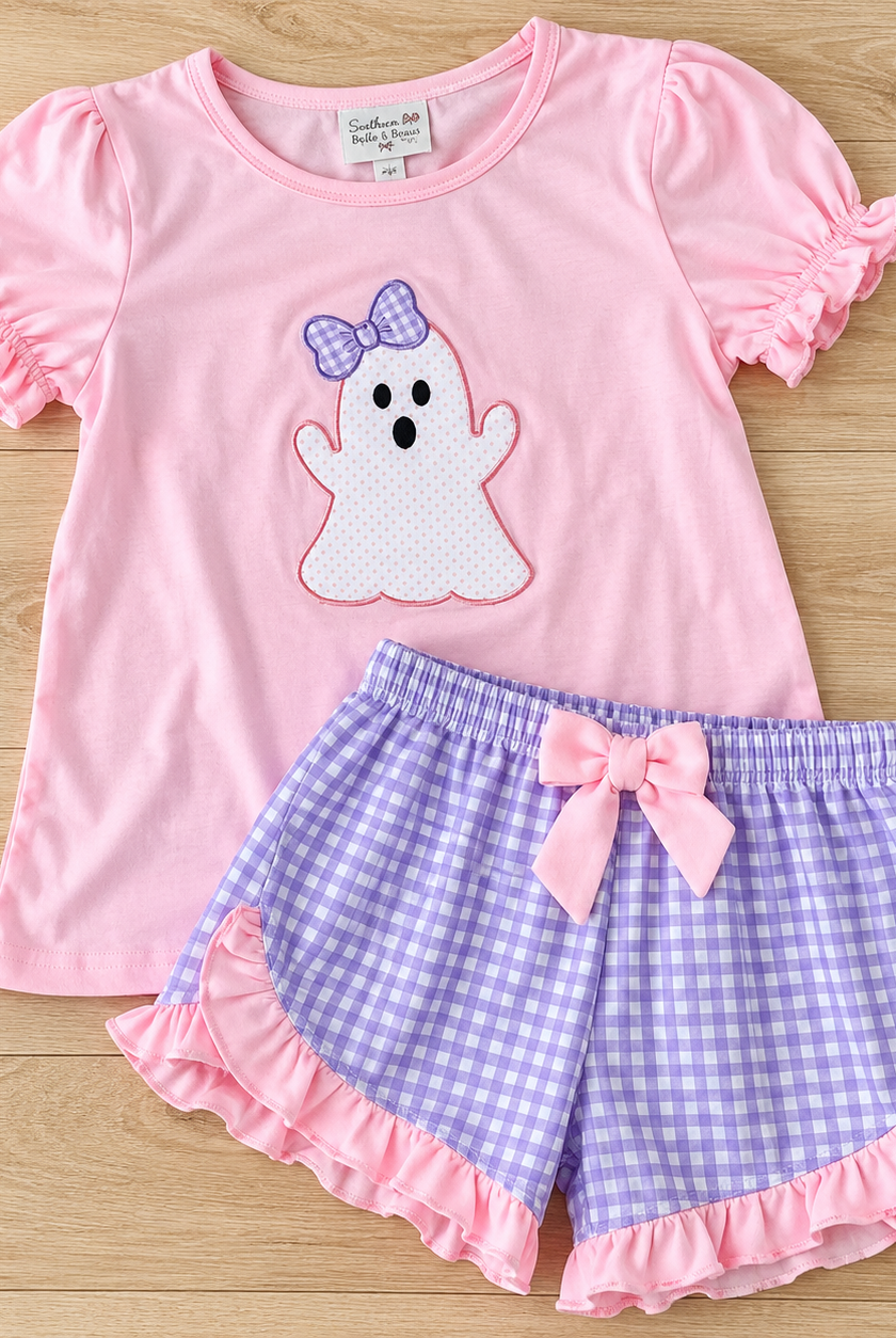 Pink puff-sleeve top with a white ghost and lavender gingham bow, paired with lavender gingham shorts with pink ruffles and a bow