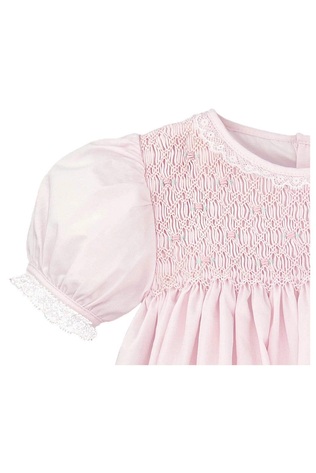 Pink dress with lace details on a white background