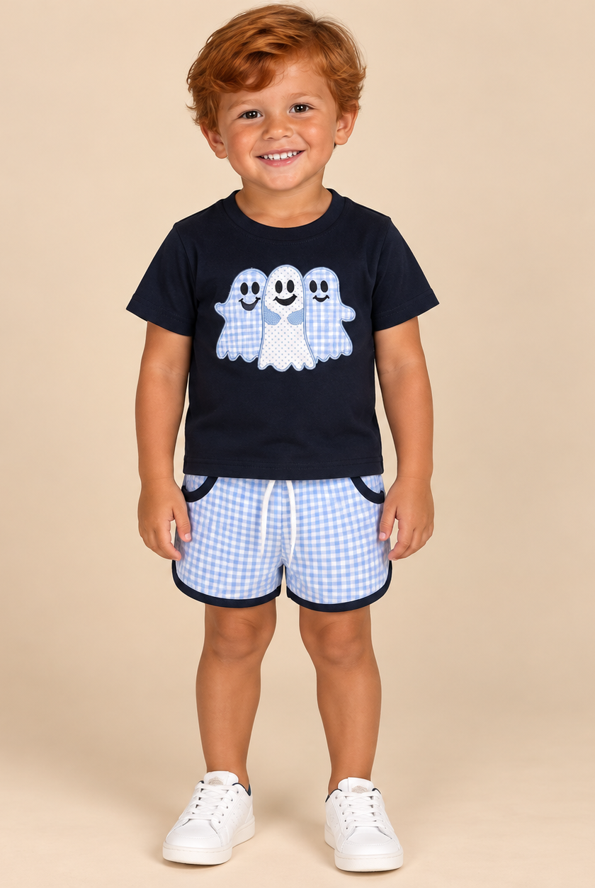 Boy wearing a navy ghost graphic tee with lavender gingham shorts and navy trim