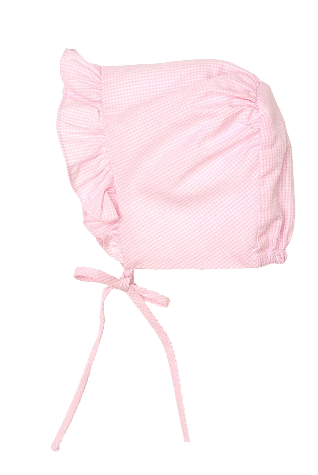 Pink baby bonnet on a white background