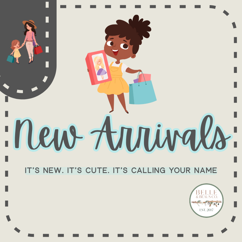 Little girl full of joy holding her shopping bag, capturing the excitement of new arrivals at Southern Belle & Beaus.