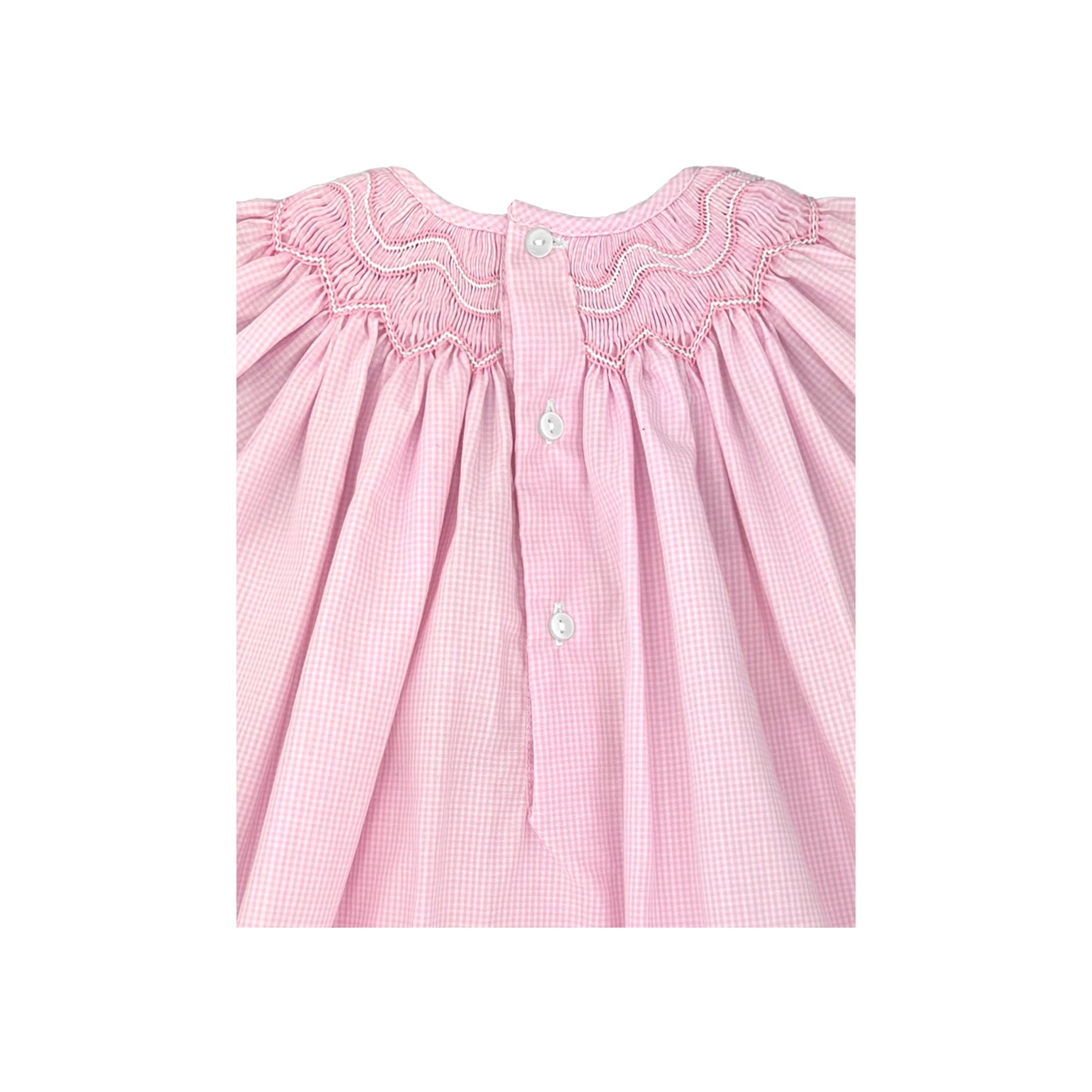 Pink checkered dress with smocked neckline on a white background