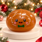 Gingerbread Christmas mystery squishy dumpling toy with green bow tie