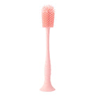 Pink bottle brush with textured head on a white background