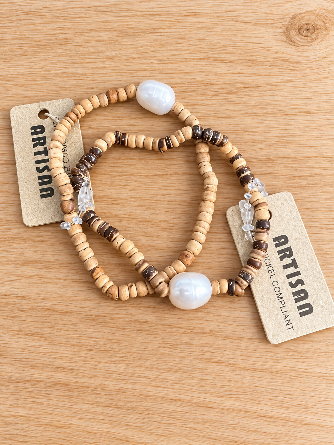 Beaded bracelets with tan and dark brown beads and white pearl-look focal beads