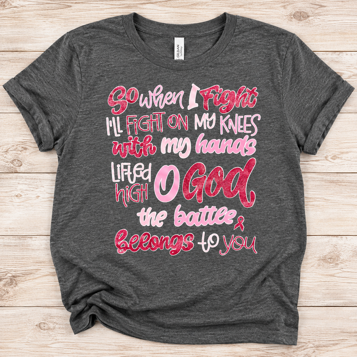 Heather charcoal crewneck T-shirt with pink and white Fight on My Knees Christian lettering and a small awareness ribbon.