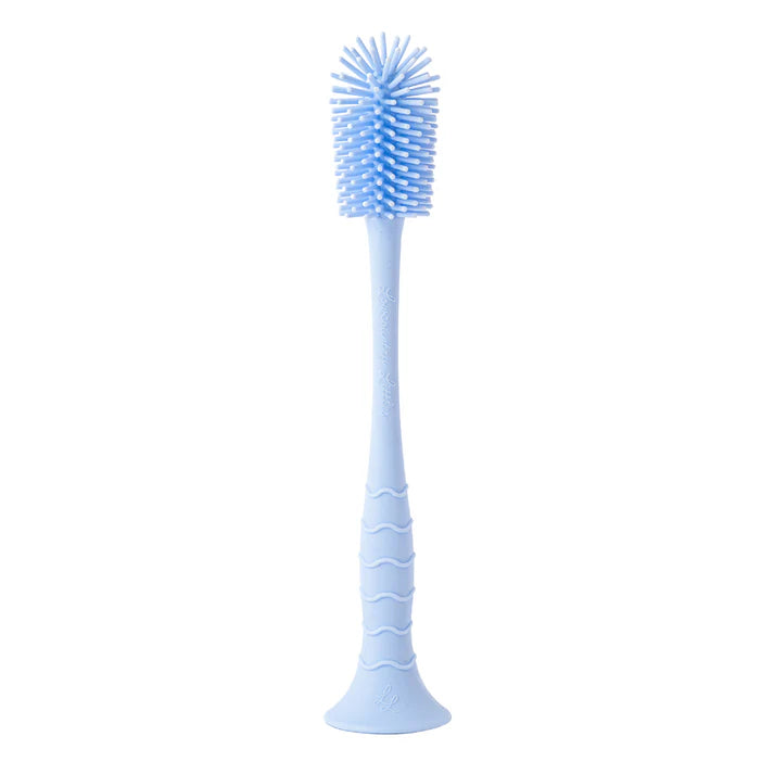 Blue bottle brush cleaning tool on a white background