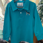Teal long-sleeve polo shirt with dog embroidery on a hanger