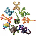 An assortment of colorful plush toy animals designed to resemble rainforest animals, each with a different pattern and color.