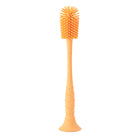 Orange silicone bottle brush on a white background