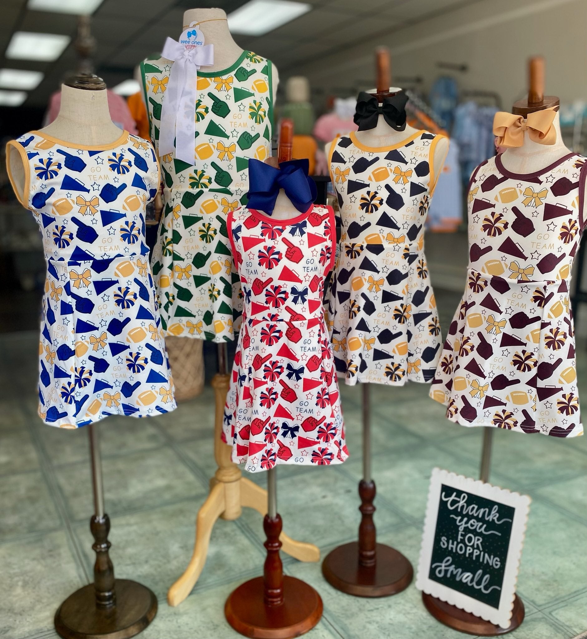 colorful game day skeeter dresses on mannequins in a store
