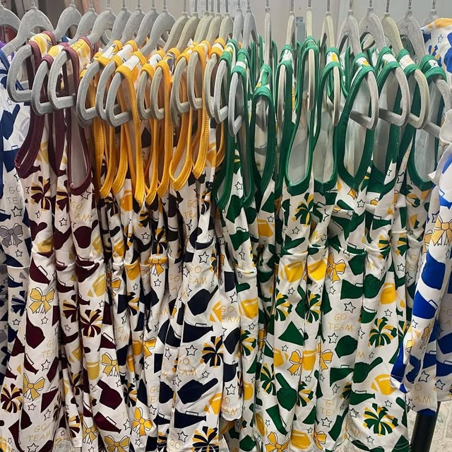 Hangers with colorful children's clothing on a rack