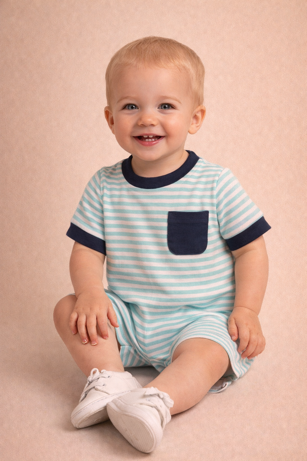 Child wearing a blue and white striped outfit with a pocket on a beige background