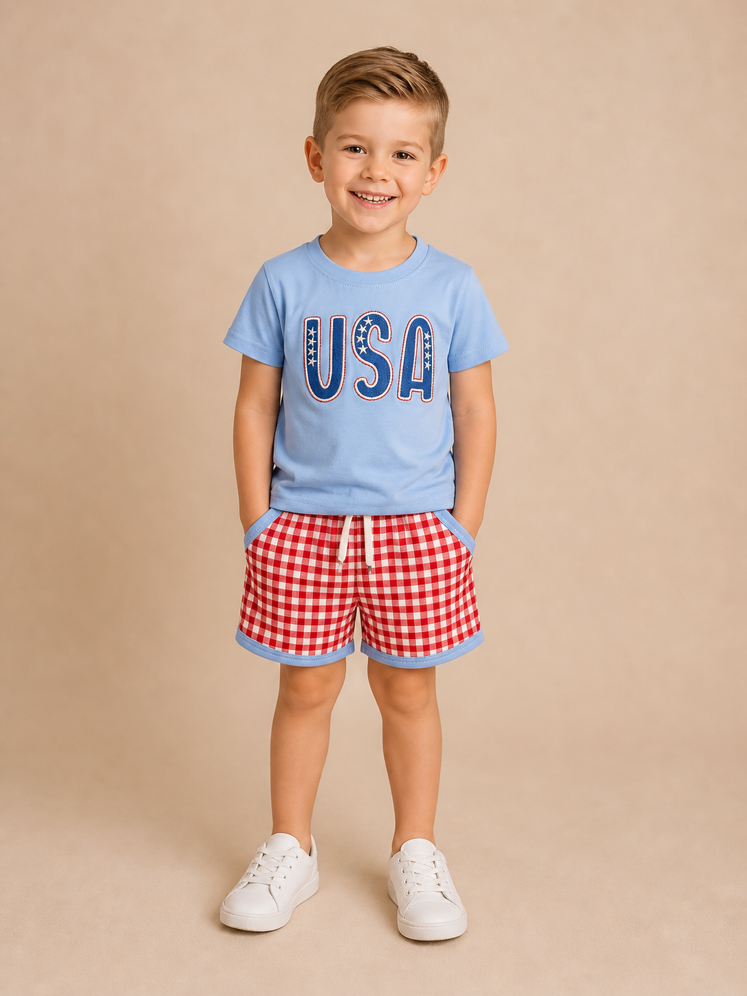 Child wearing a blue 'USA' t-shirt and red checkered shorts on a beige background
