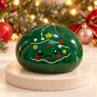 Green sparkly Christmas tree mystery squishy dumpling toy with star