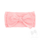 pink nylon baby headband with a bow
