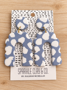 Blue-gray and white spotted clay earrings with round tops, scalloped arch drops, and gold-tone connecting rings