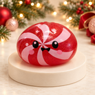 Peppermint candy Christmas mystery squishy dumpling toy with red swirls