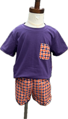 Purple t-shirt with a pocket and checkered shorts on a mannequin against a white background