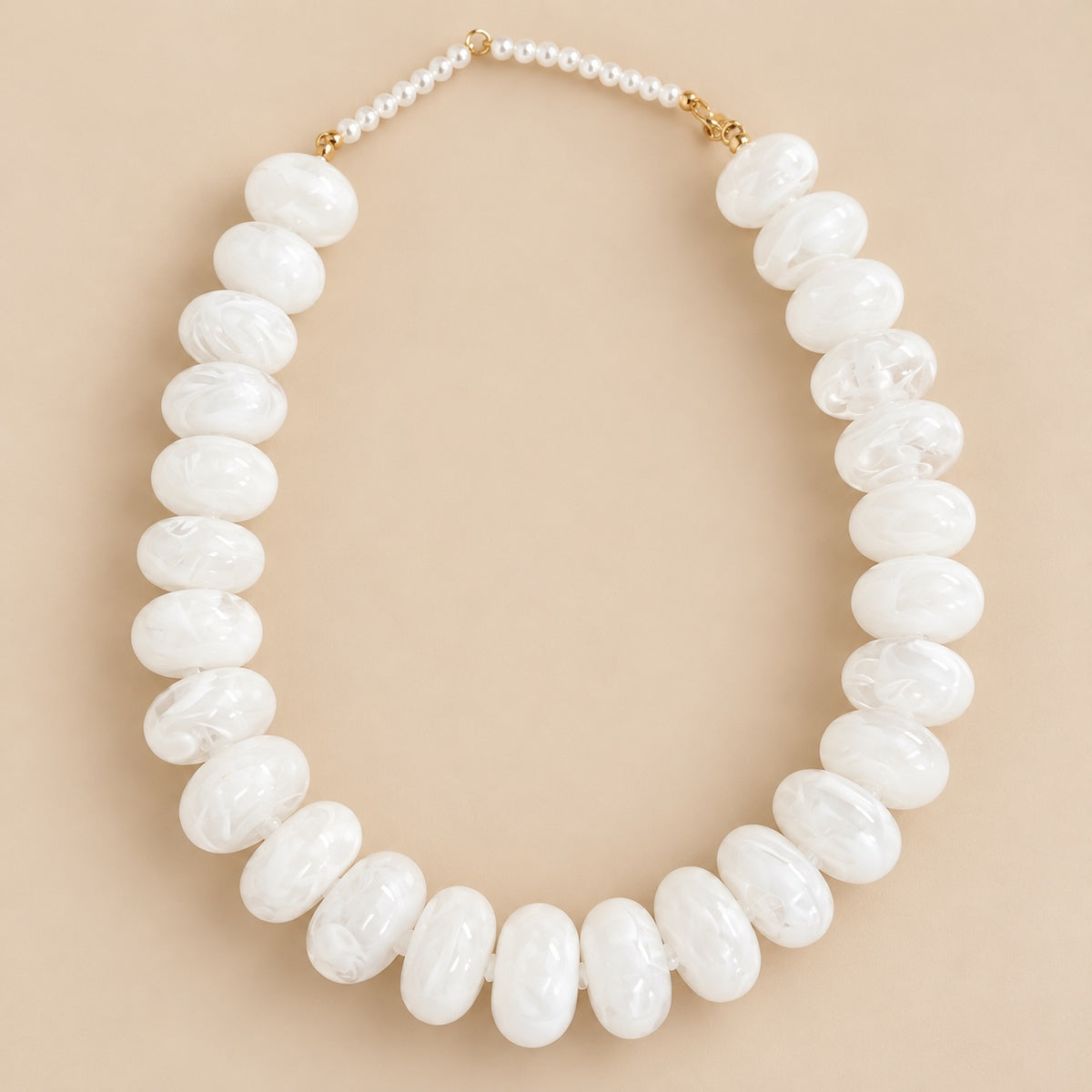 Big beaded pearl colored necklace.