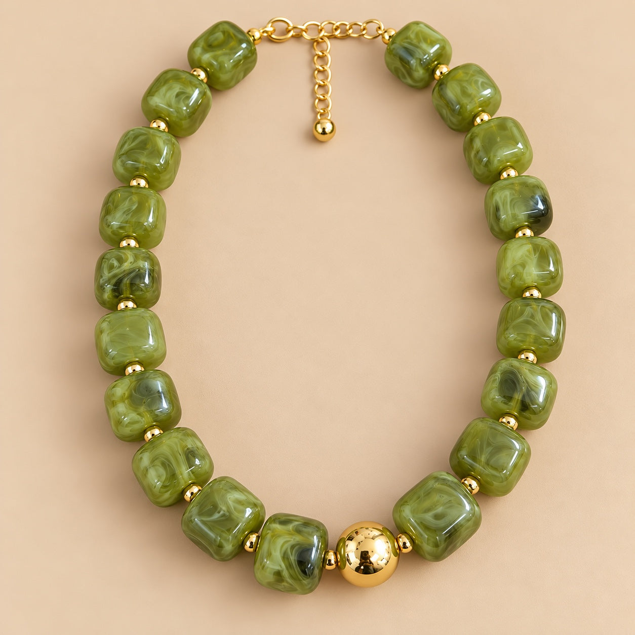 Olive Marble Gold Bead Necklace is a women's jade green beaded statement necklace with gold-tone spacers.
