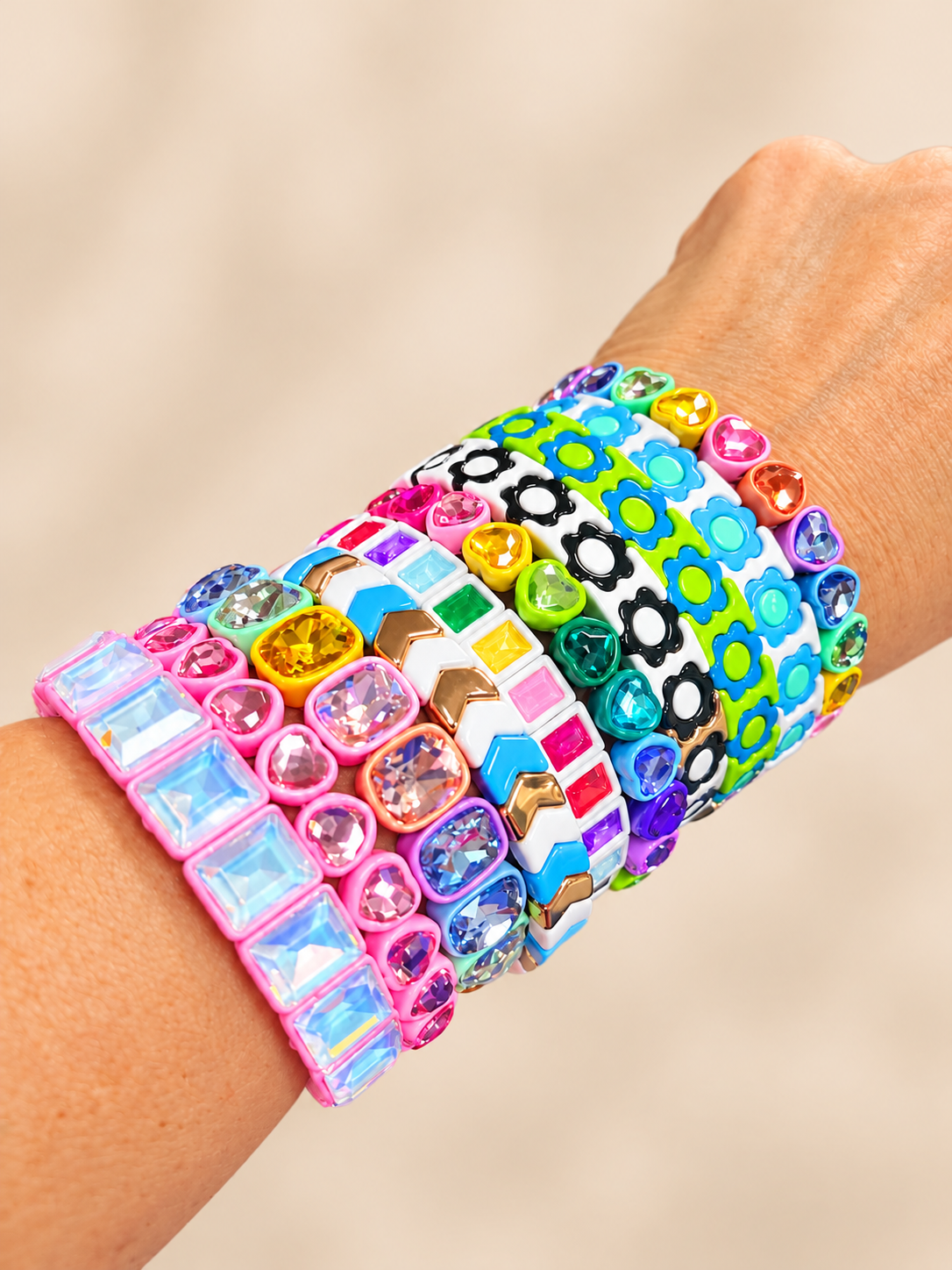 Cute, colorful, stackable bracelets. Hearts, flowers, and all.