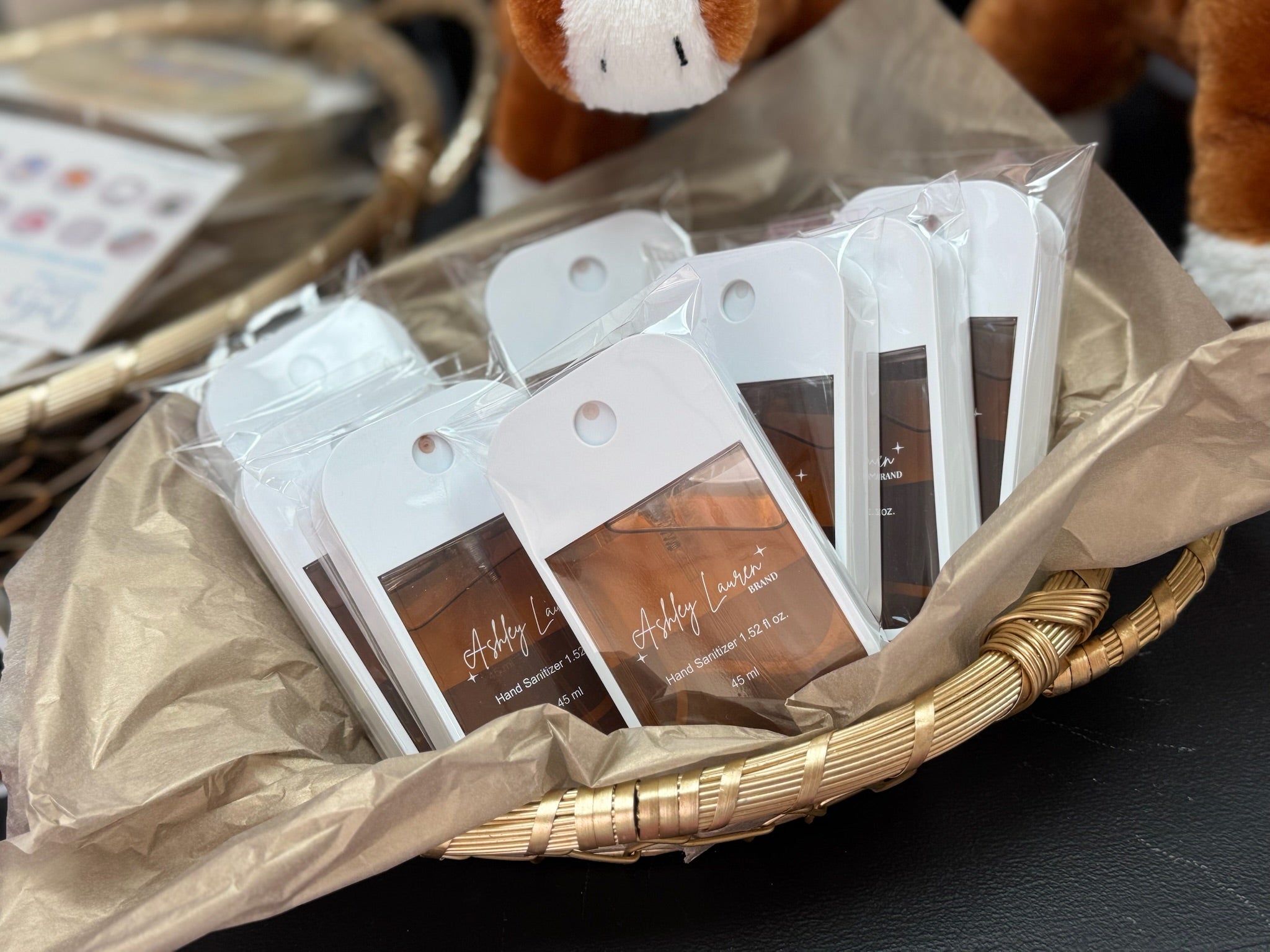 Packaged sanitizer in a basket on a table. 