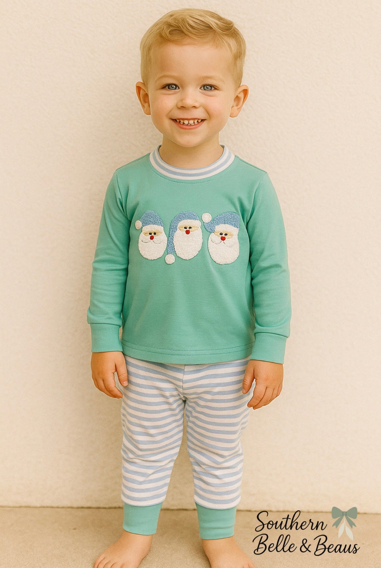 Mint green long sleeve top with French Knot embroidered Santa’s, light blue striped jogger pants. 