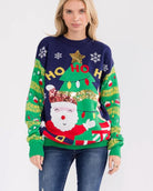 Person wearing a festive Christmas sweater with Santa Claus and tree design.