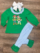 Girls Christmas ruffle outfit with cowboy and space ranger characters in Santa hats, green top with blue polka dot ruffles from the To the North Pole & Beyond Collection by Southern Belle & Beaus.