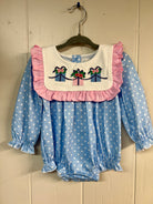 Blue polka dot baby bubble with pink ruffles and embroidered gift boxes — Wrapped With Love Collection .