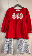 Red long-sleeve girls’ tunic with three Christmas tree appliqués, paired with white bell-bottom pants featuring red and green sprinkle stripes