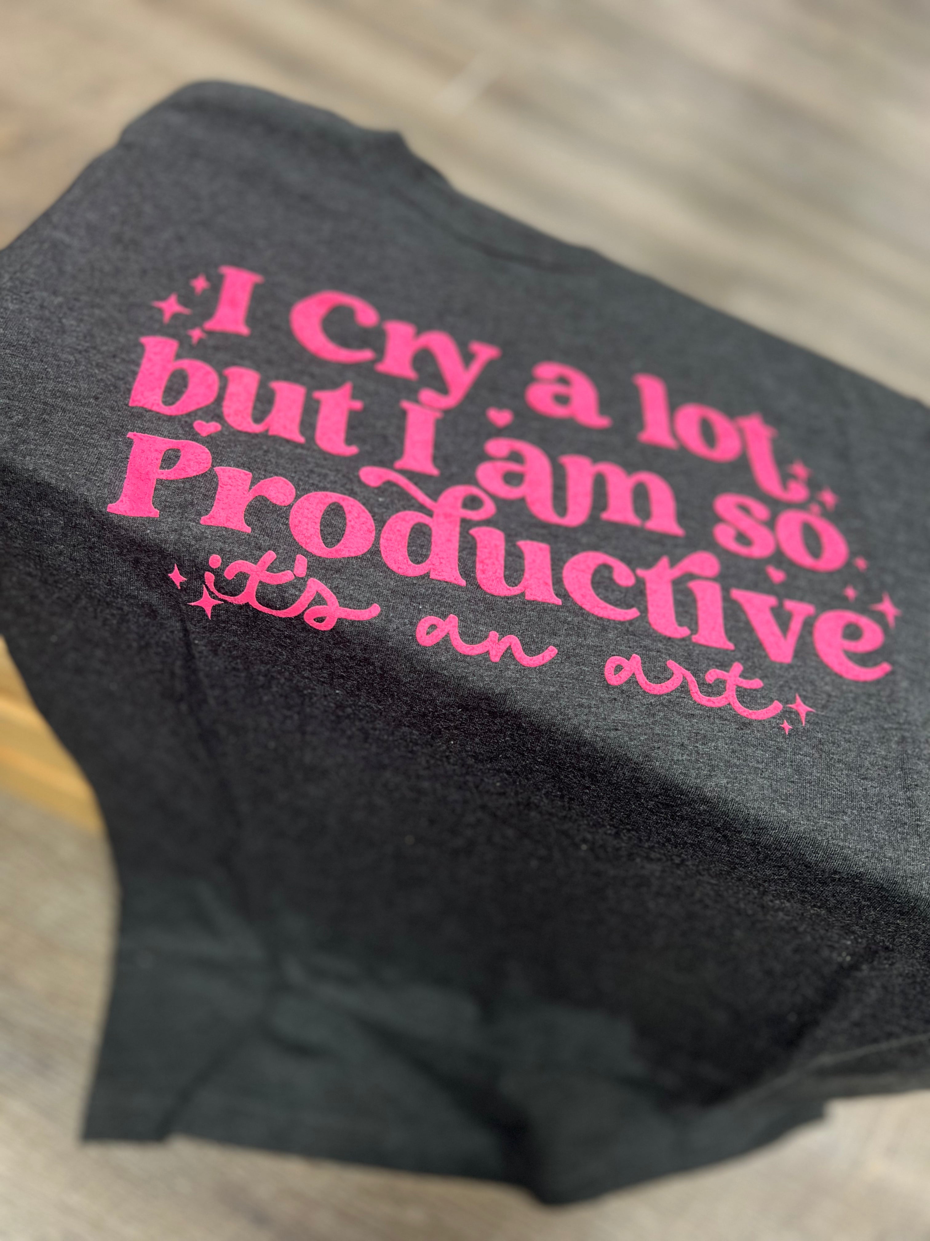 Charcoal gray ladies' tee with 'I Cry A Lot But I am So Productive it's An Art' pink text
